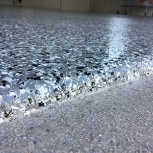 Close up of a garage epoxy chip floor