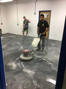 Our crew, having fun while they finish a beautiful metallic epoxy floor!